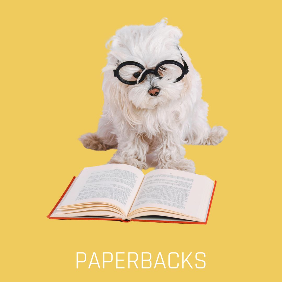 A dog wearing glasses reads a book. Text reads: paperbacks